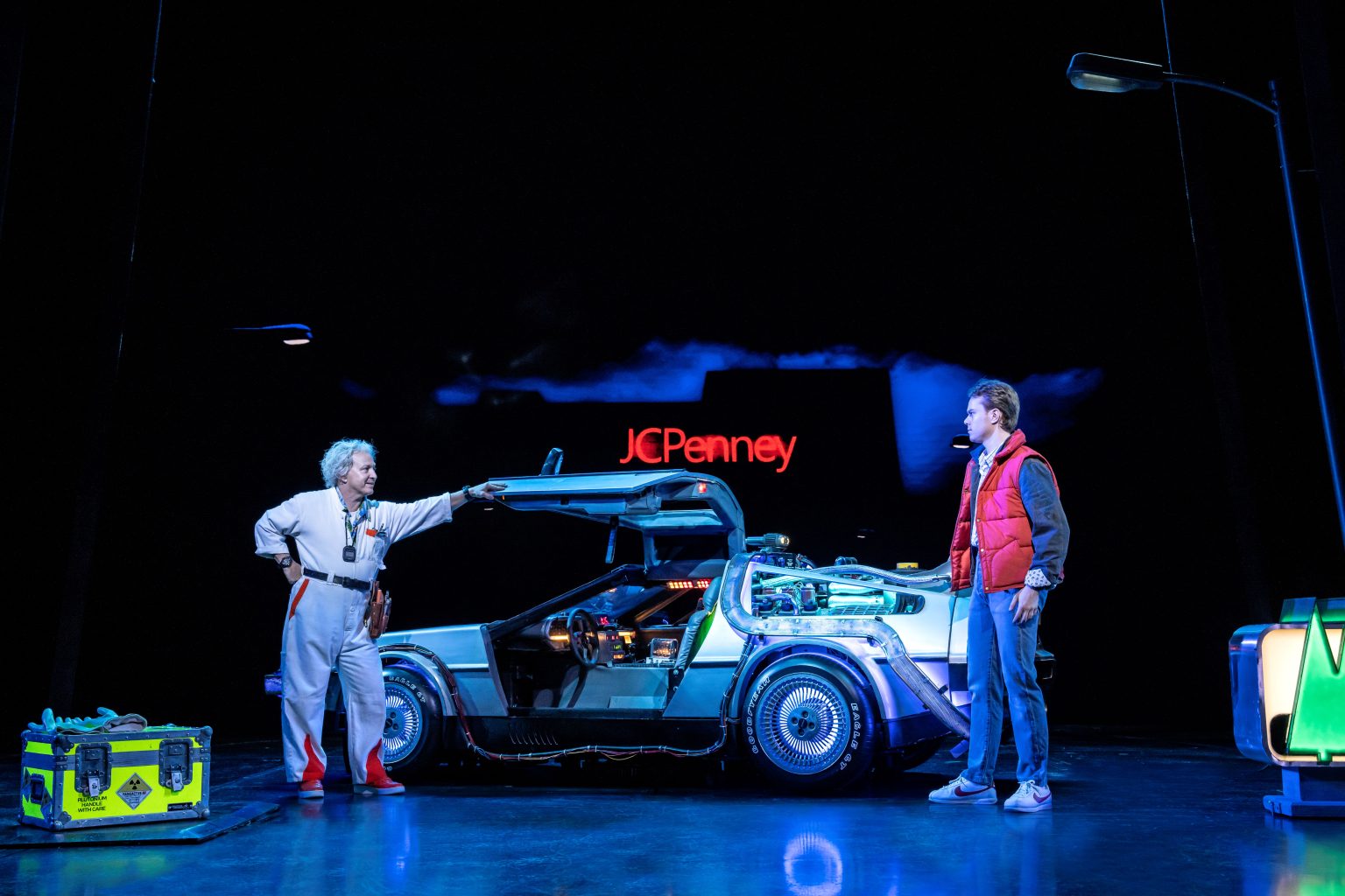 Back to the Future the Musical on stage shot of Marty, Doc and the DeLorean